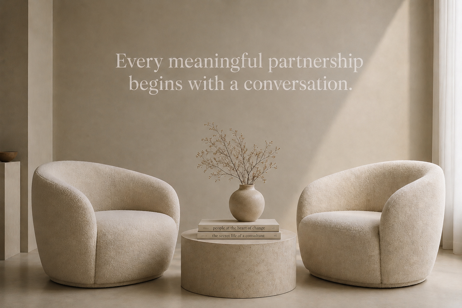 Two armchairs facing each other beneath the words: Every meaningful partnership begins with a conversation
